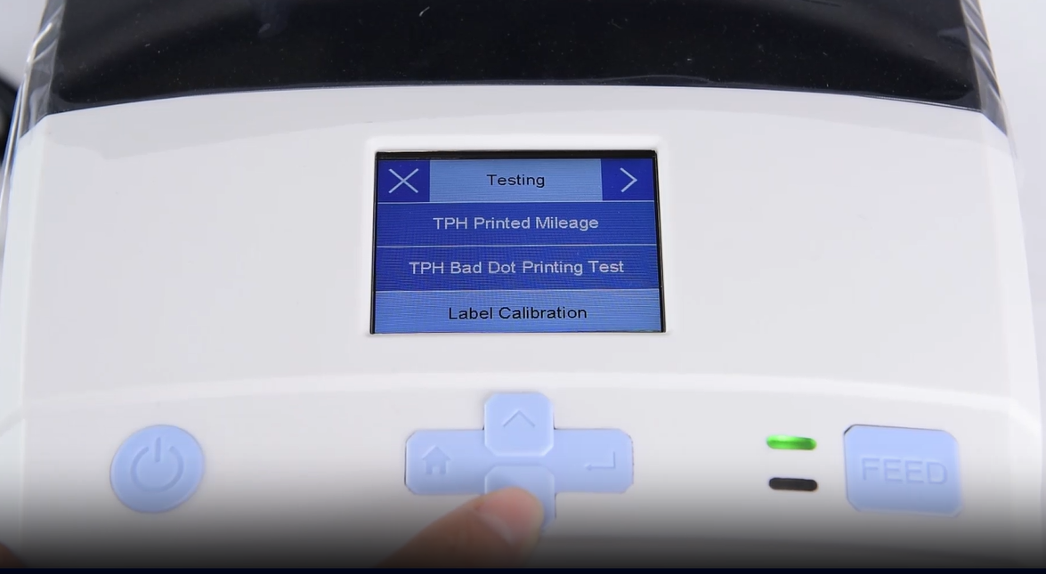 एक close-up of a machine's digital interface showing a testing menu.